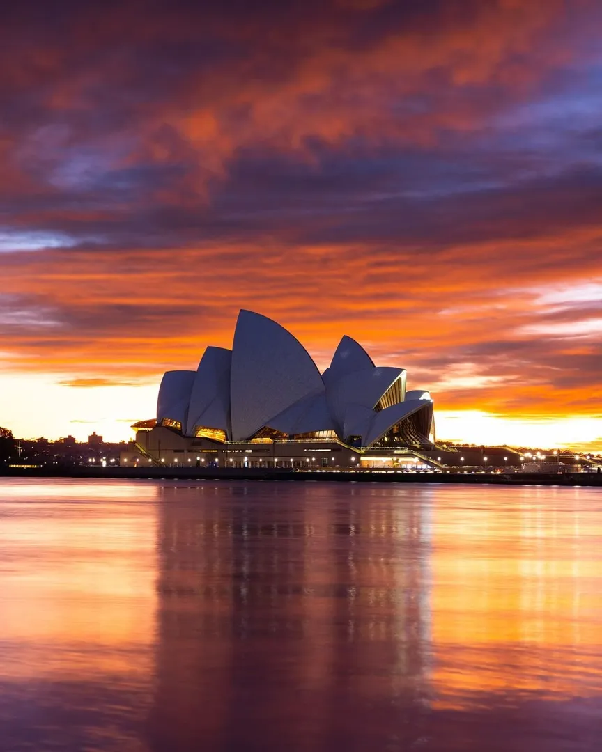 Sydney Opera House at sunset over water